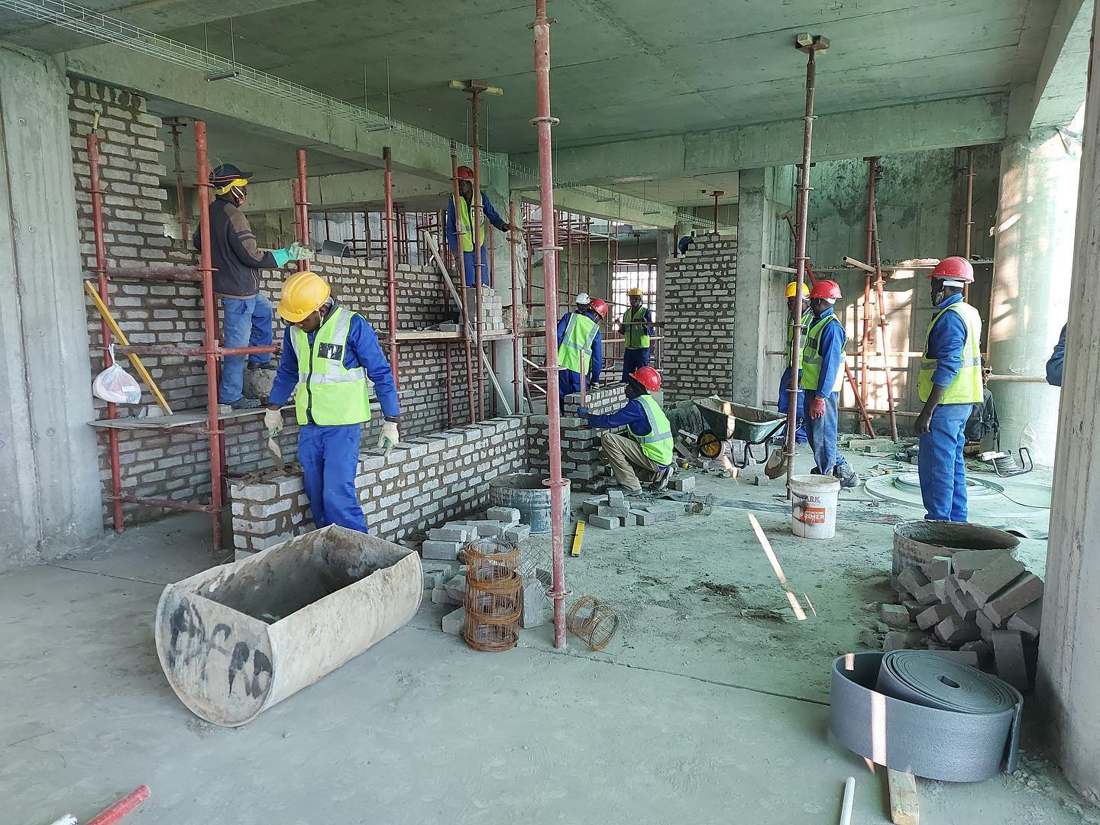 After stage showing a completed residential building exterior